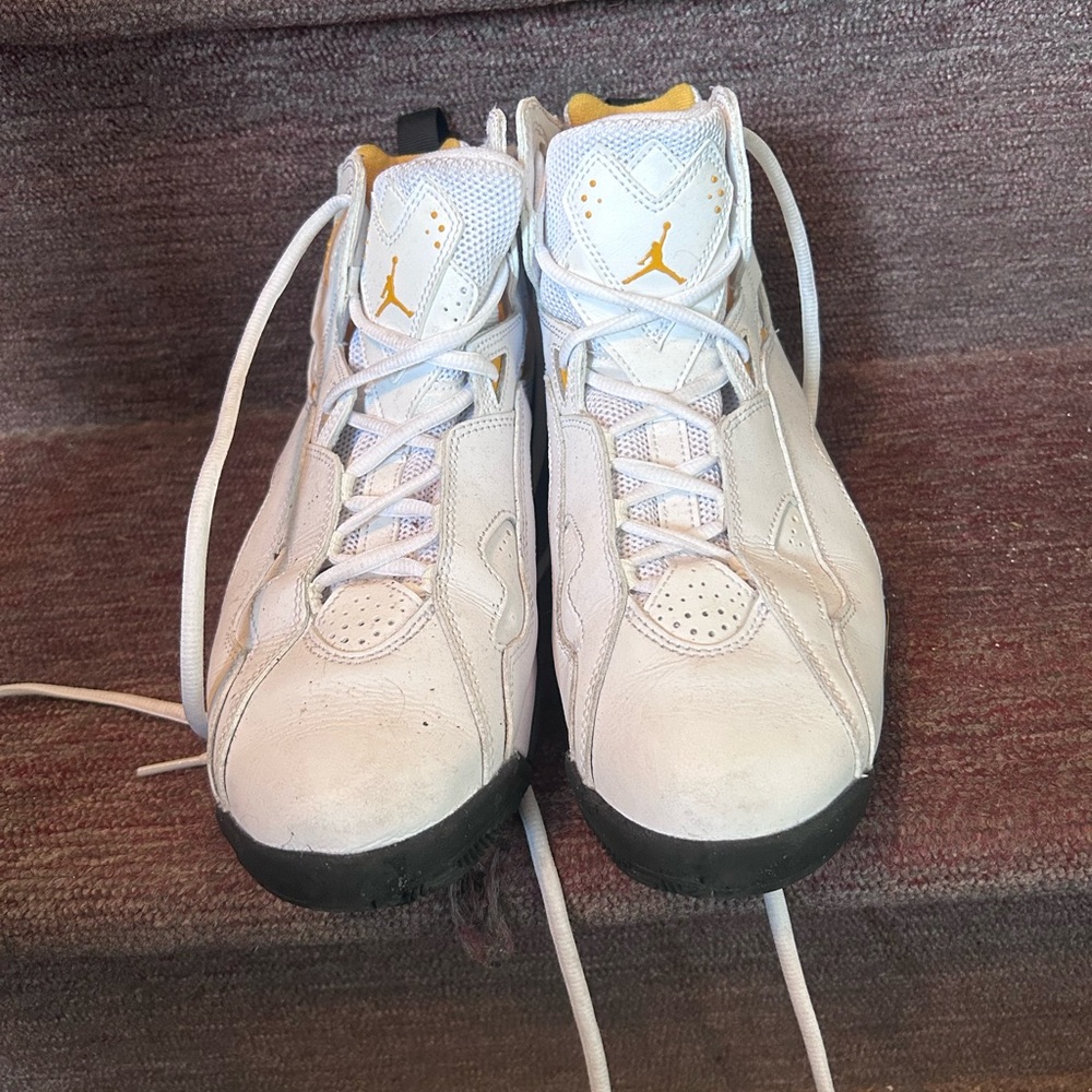 Air Jordan White, Gold, and Black Sneakers